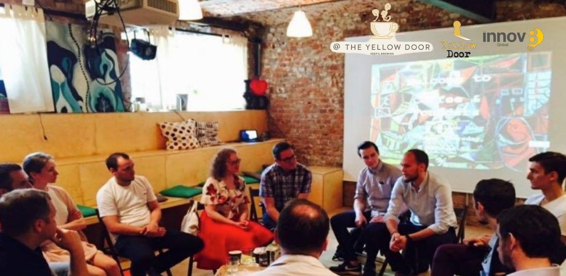 Founders sitting in a circle for Founders Coffee at The Yellow Door